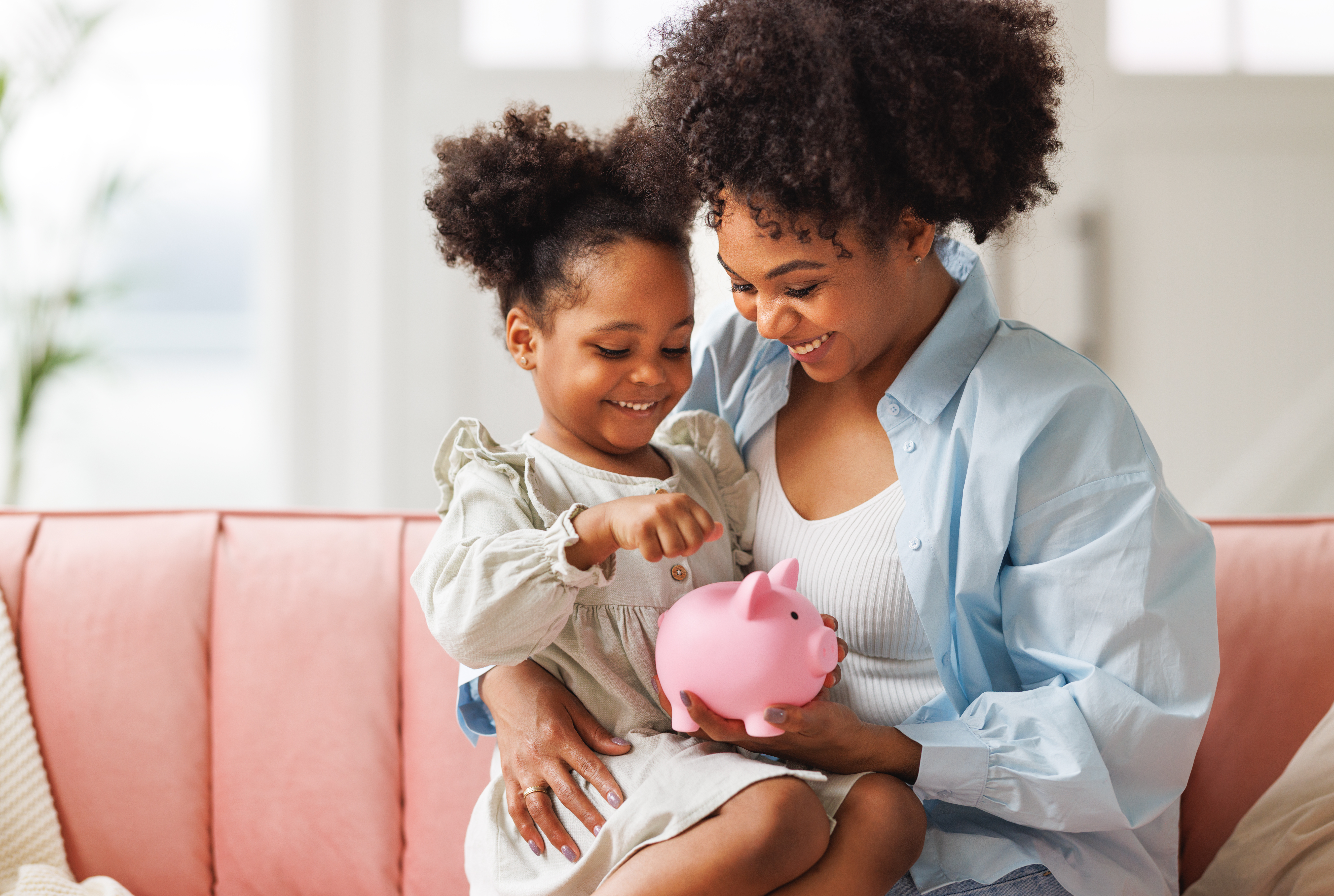 Mother+Child Savings savings, effective savings goals for kids, savings goals for kids, savings goals, savings goals for children, mother and daughter with piggy bank, savings habits