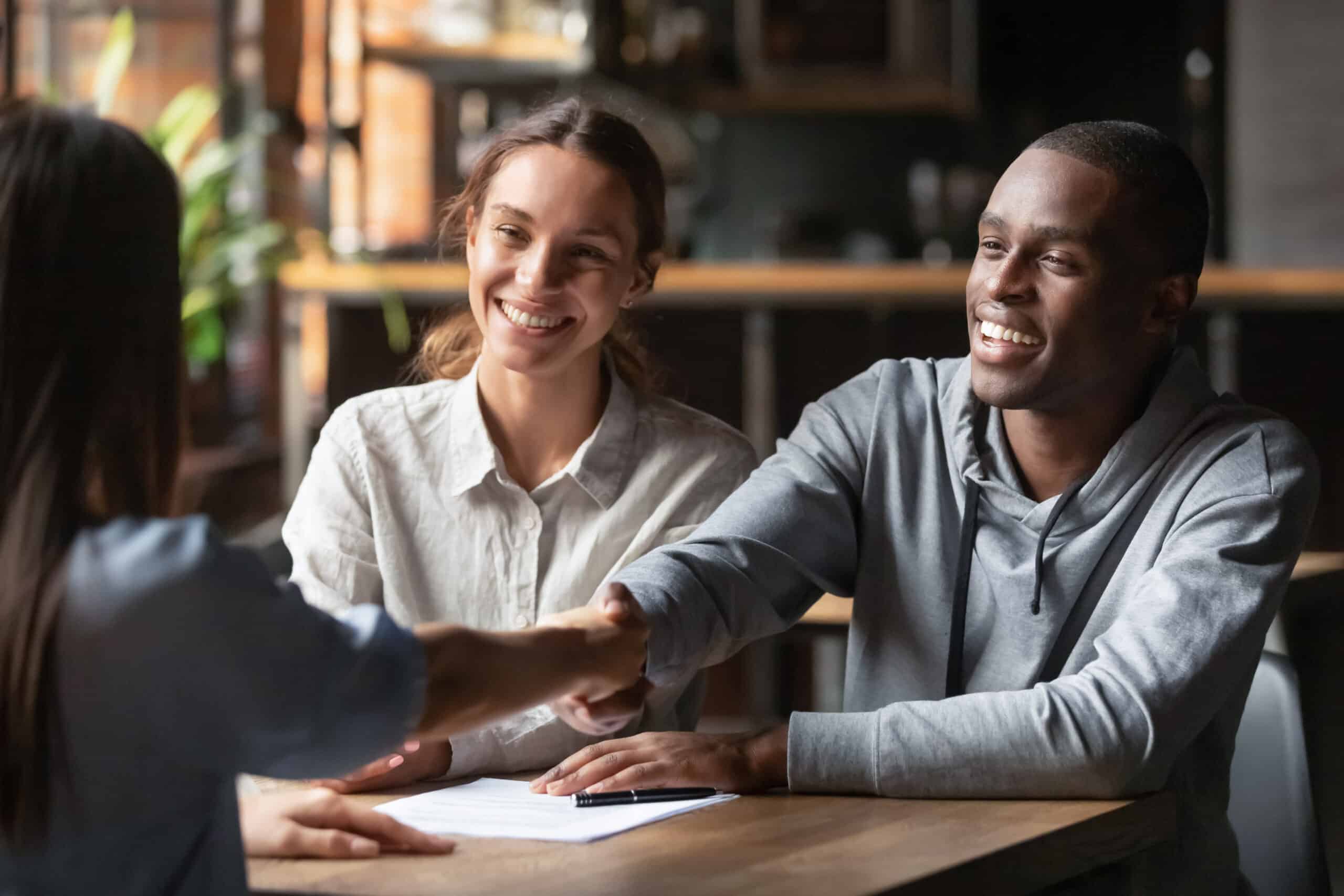 couple discussing mortgage with local lender, local bank, community bank, local lending, local mortgage lender, benefits of using a local lender for your home loan